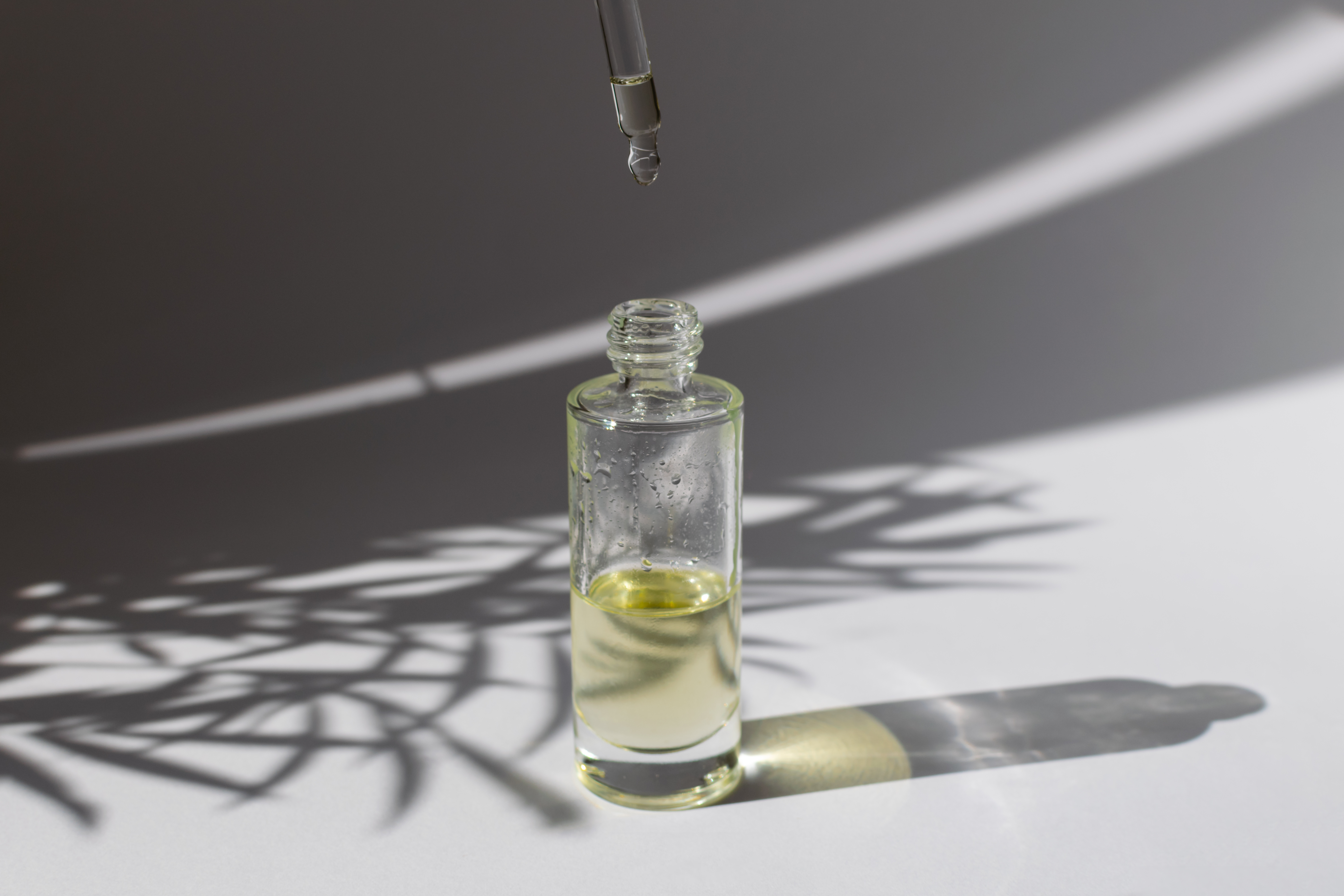 Beauty skincare concept - dropper glass bottle with cosmetic oil